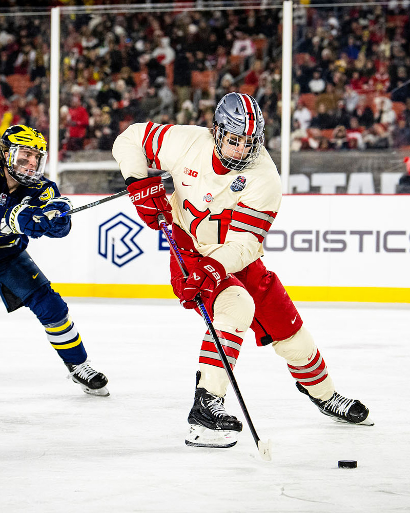 The Ohio State University hockey player on ice at Huntington Bank Field 