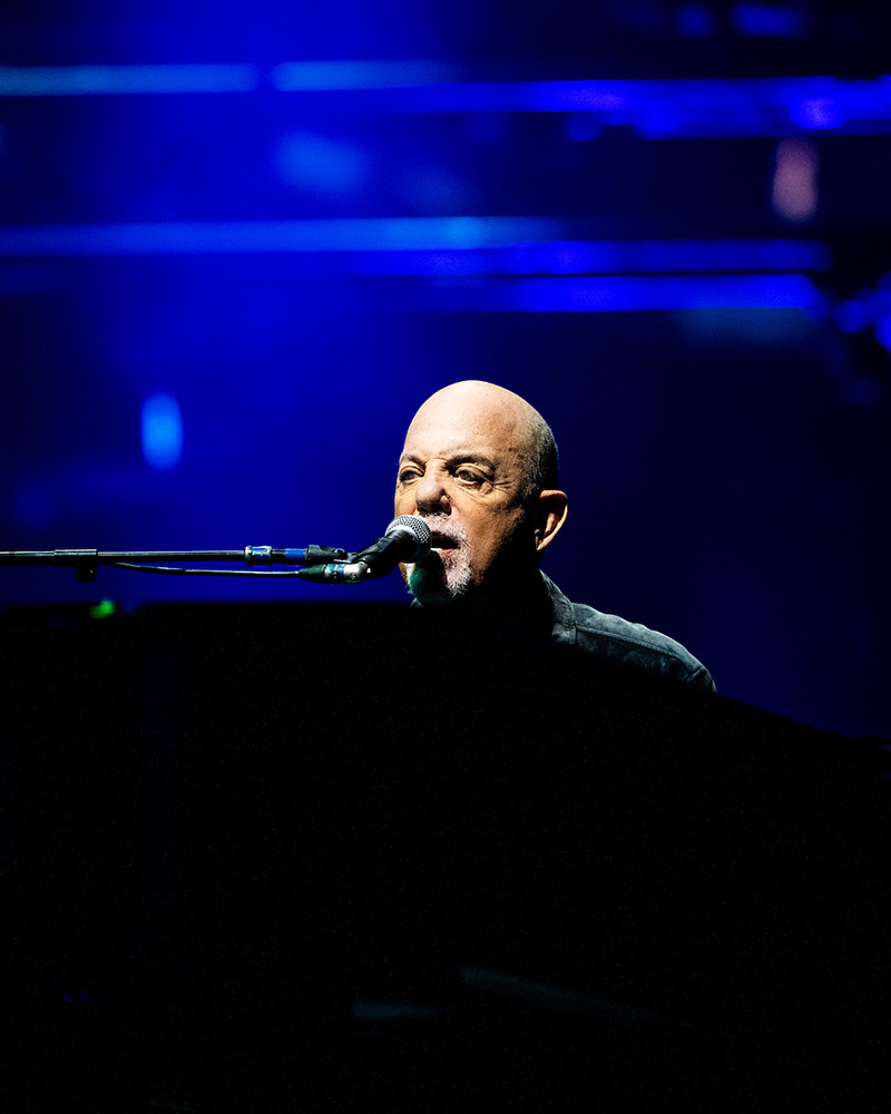 Billy Joel playing piano at Huntington Bank Field